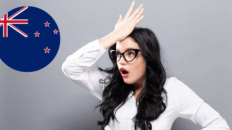 Common mistakes when moving to New Zealand - Person reviewing migration planning documents with crossed out mistakes