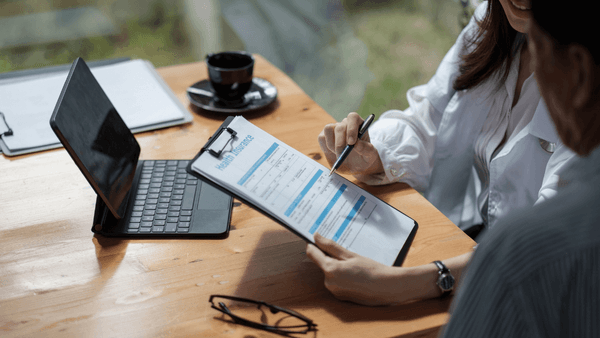 Insurance in New Zealand - Family reviewing health, car, and home insurance options for migrants