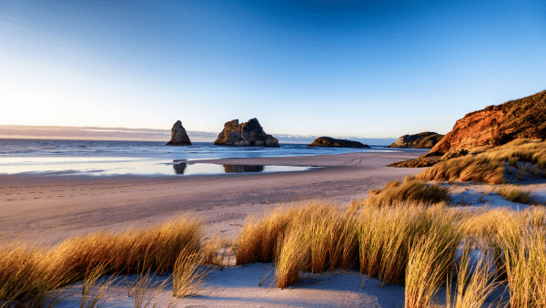 Why Move to New Zealand - Beautiful New Zealand landscape with mountains and pristine lakes